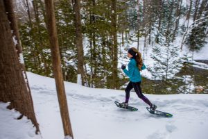 Woman snow shoeing Winter Park Colorado