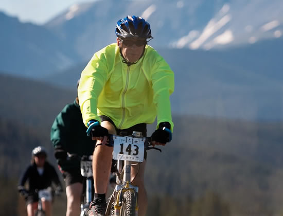 man biking in race in Colorado mountains