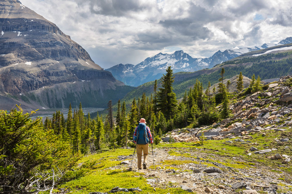 Man hiking through a mountain pass