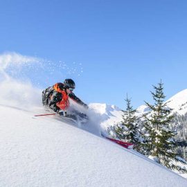 man skiing downhill. winter recreation concept
