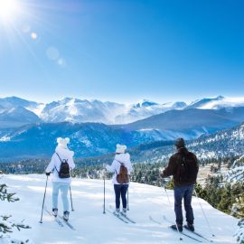3 people skiing in Winter Park, Colorado mountains