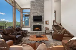 Furnished living room in The Reserve facing the fireplace